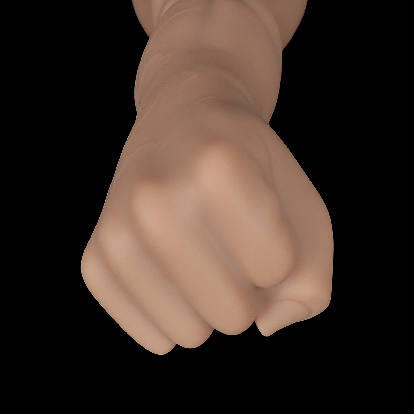 Extreme close-up of the clenched fist head, highlighting the skin-like texture and realistic knuckle definition.