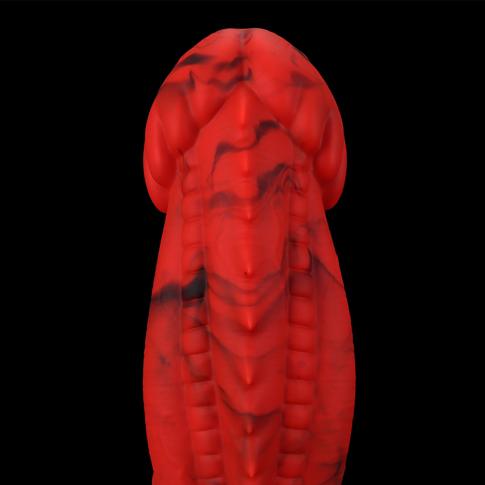 Top-down view of the dragon dildo showing the symmetrical scale-like ridges and anatomical head design.