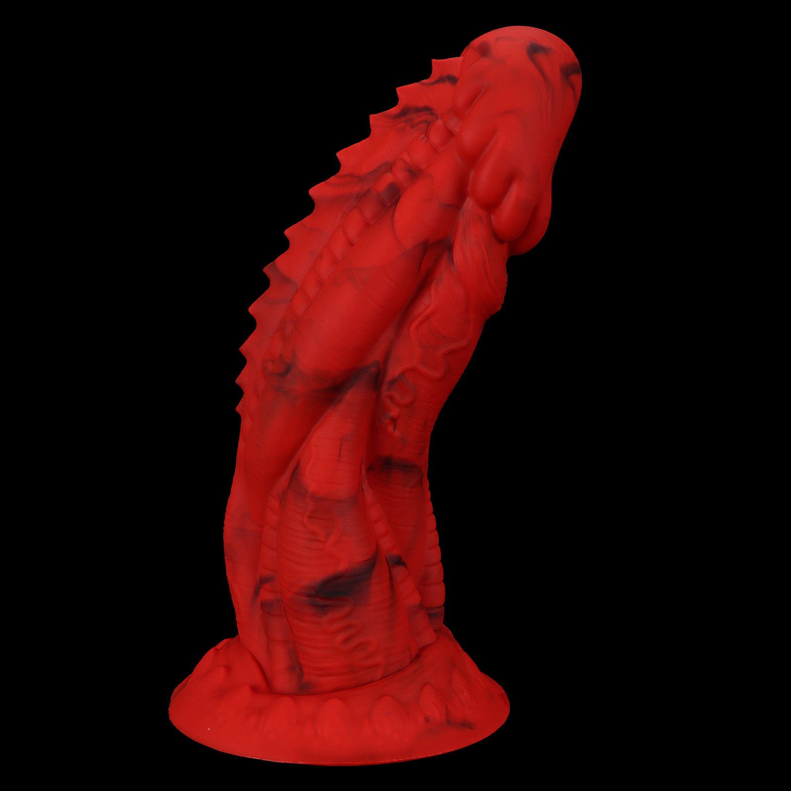 Side profile of the red marbled dragon dildo on a black background, emphasizing the realistic dorsal fins and textured shaft.