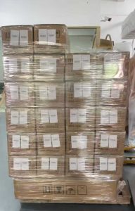 A high-stacked pallet professionally wrapped in protective film ready for export shipment at the factory.