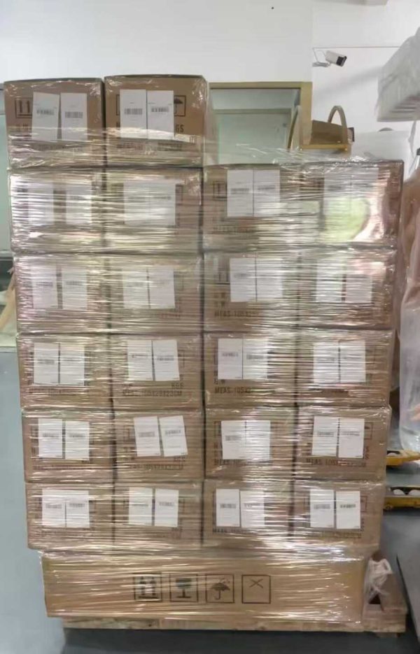 A high-stacked pallet professionally wrapped in protective film ready for export shipment at the factory.