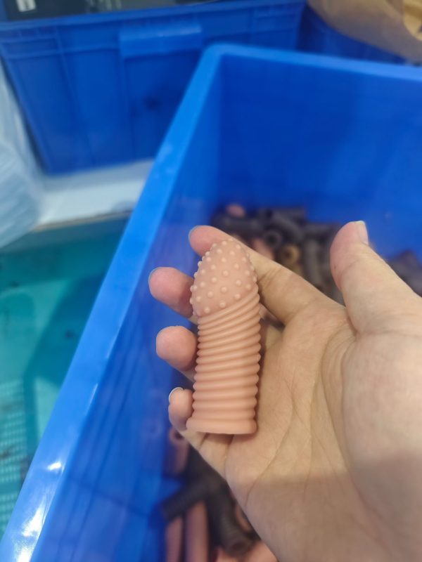 Spiral ribbed pink silicone penis sleeve detailed texture view