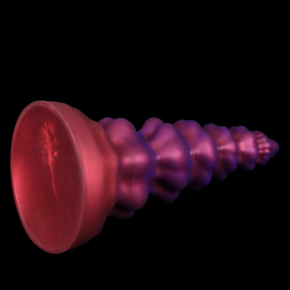 Horizontal profile of the spiral dildo showcasing the powerful suction cup base for hands-free stability.