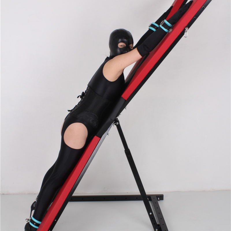 Side view of adjustable X-shaped restraint rack for BDSM bondage
