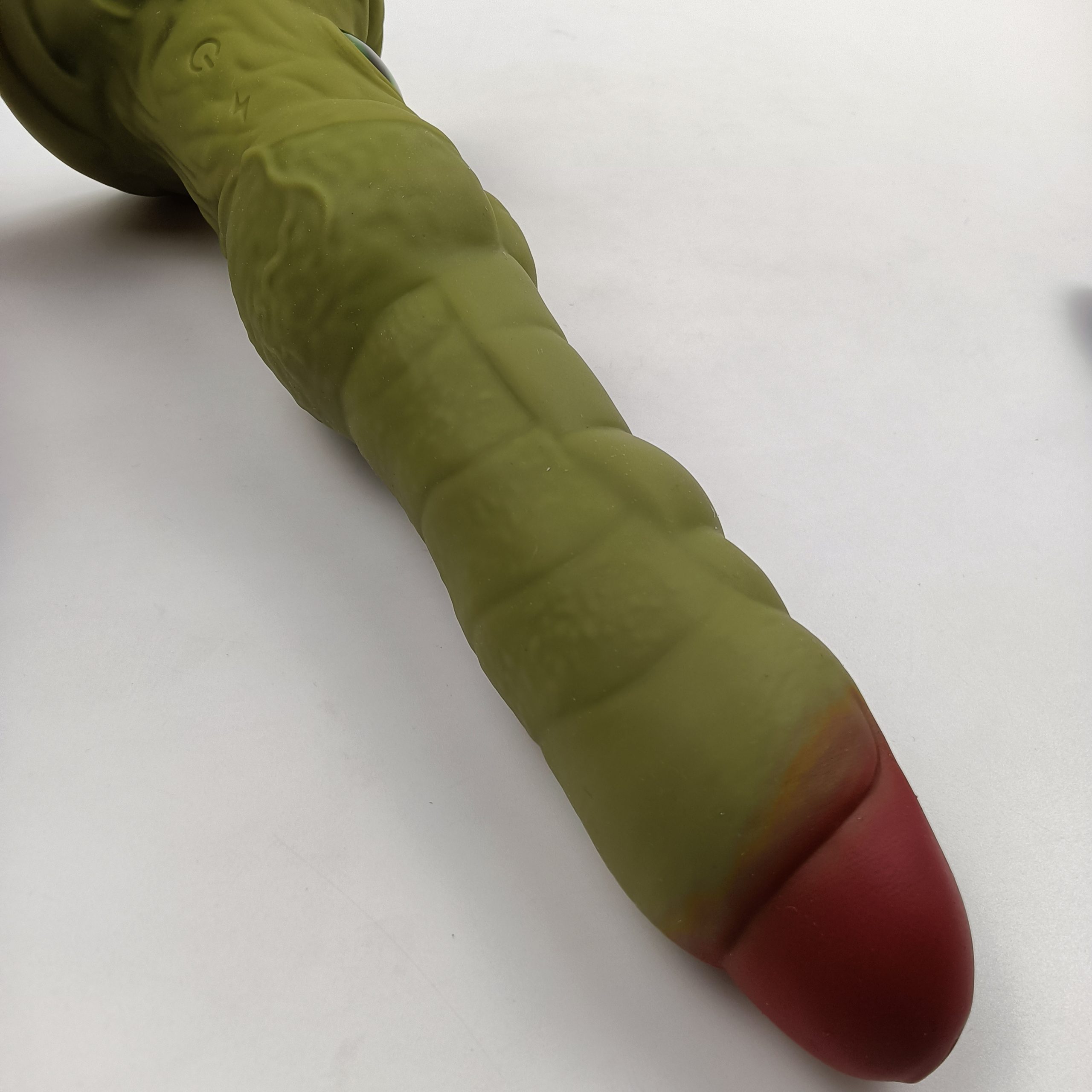 Alien thrusting vibrator angled view showing red tip and textured body