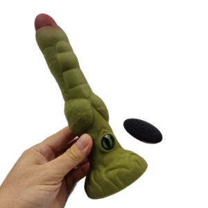 Hand holding alien thrusting vibrator showing eye and texture details
