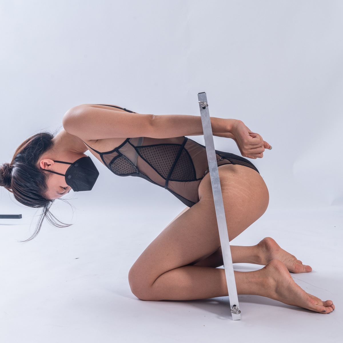 Model demonstrating the use of SM6805 BDSM body restraint board