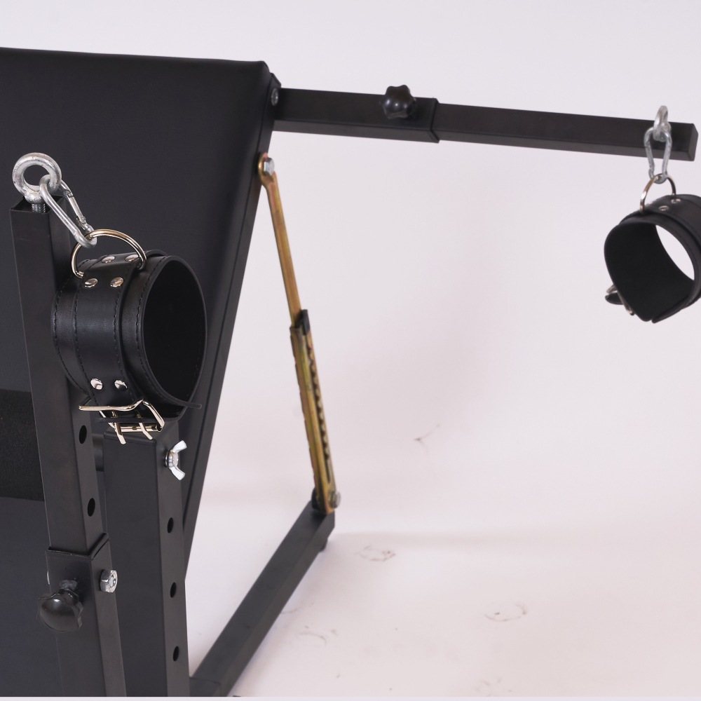 Detail of cuff attachment points on bondage chair