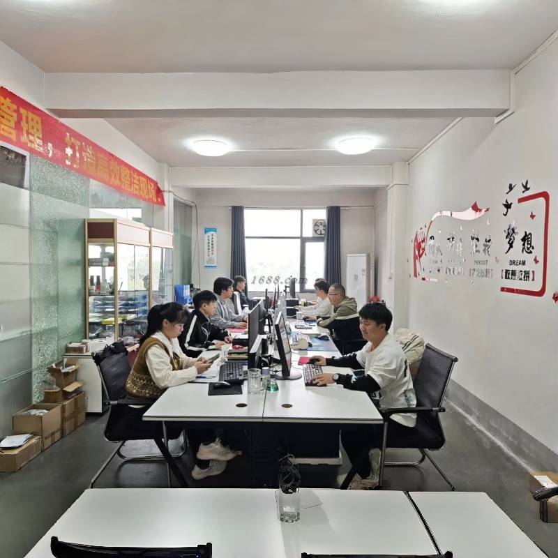 PleasureMo design and support team working on product customization and client solutions in Dongguan office.