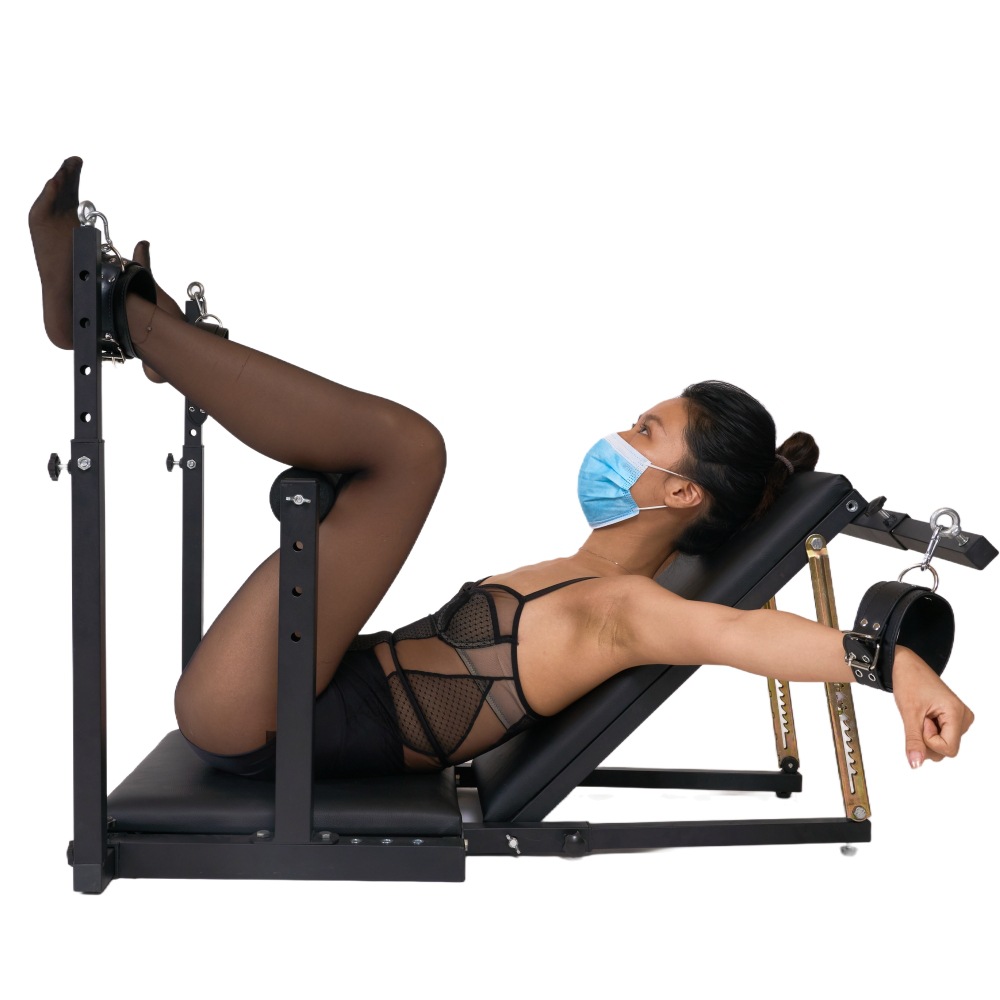 Model using BDSM leg spreader restraint chair in studio