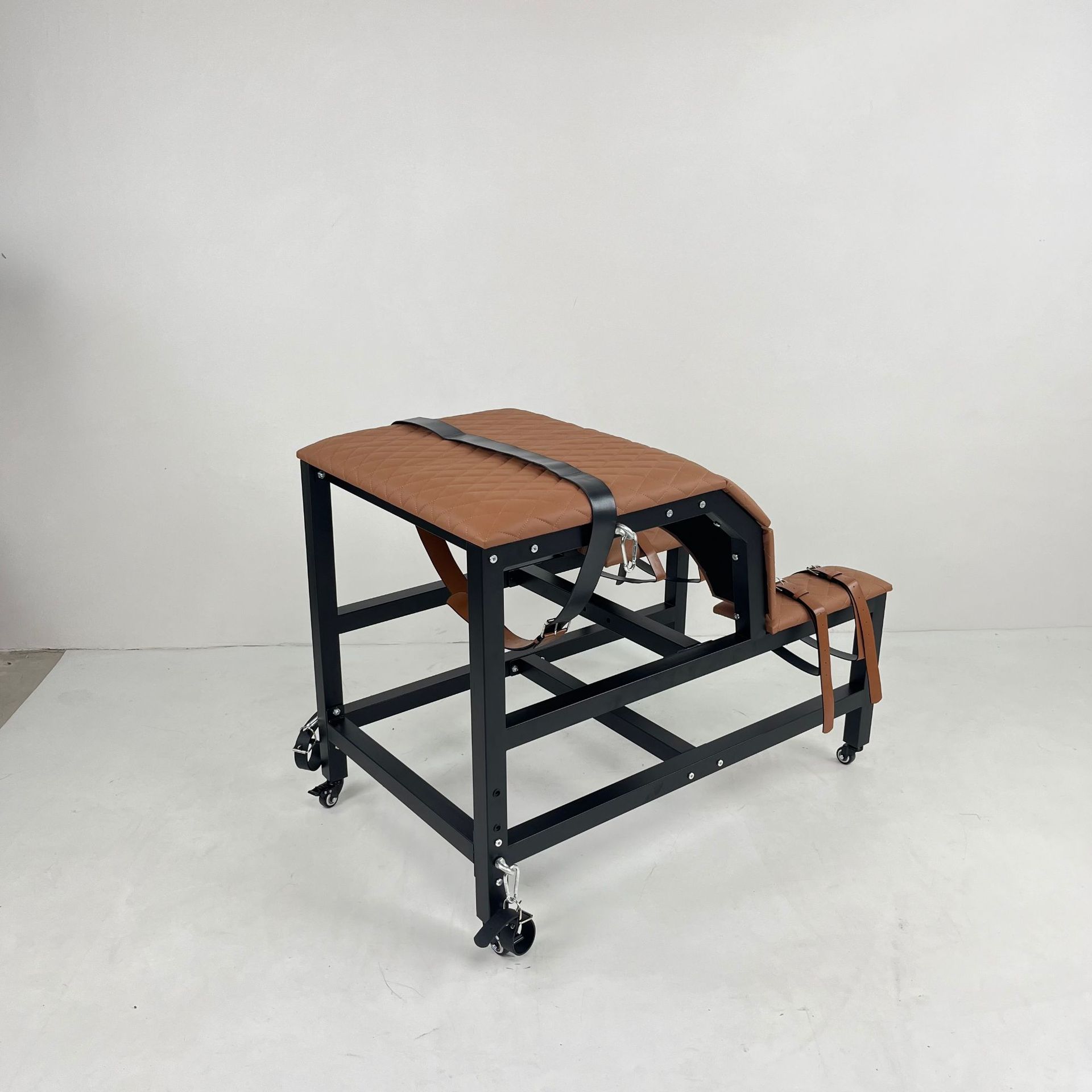 Side view of the SM6121 BDSM restraint chair in brown