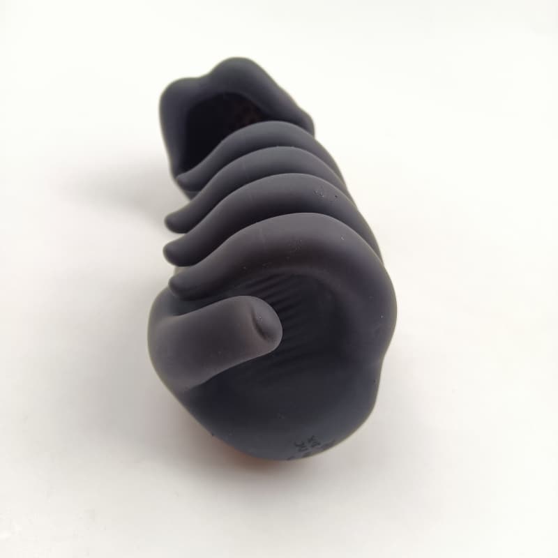 Full-body angled view of the black silicone hand-twist vibrating penis massager