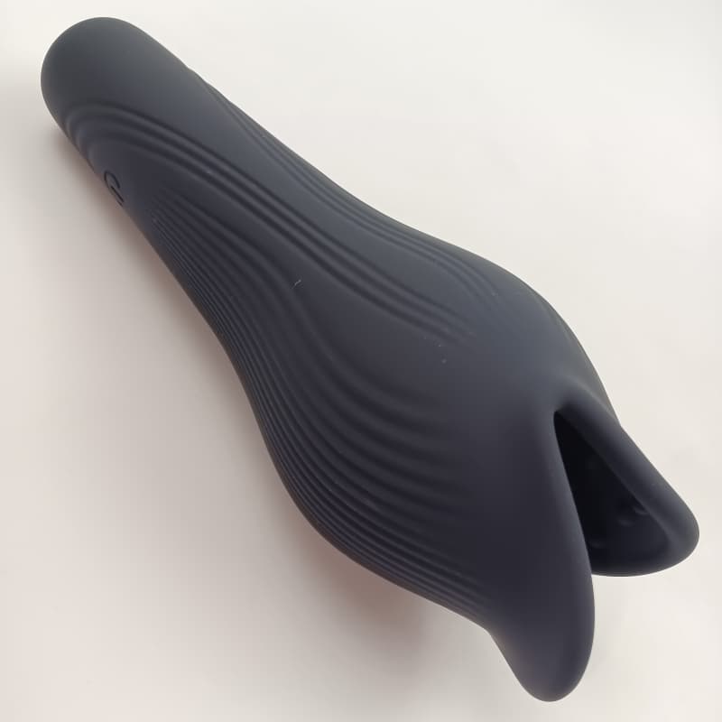 Petal-style flexible opening structure of the black whale penis trainer